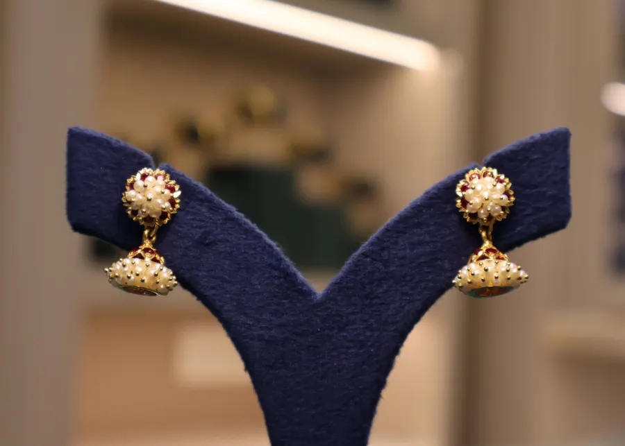 Gold drop earrings with red stones